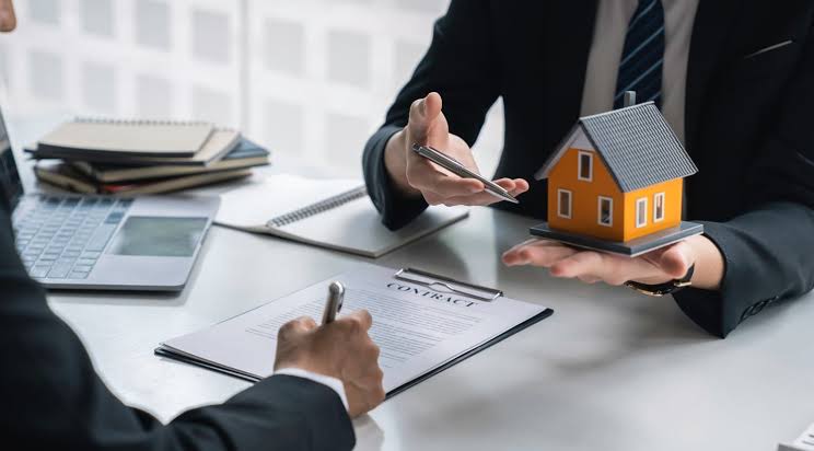 Real estate agent reviewing a contract with a client